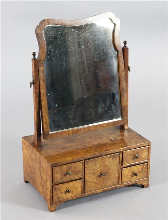 An early 18th century walnut toilet mirror, W.1ft 5in. H.2ft 2in.